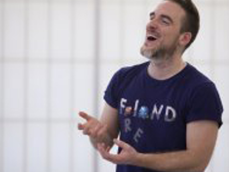 Headshot of Tim Casson. White male with beard laughing wearing blue top Headshot of Tim Casson. White male with beard laughing wearing blue top