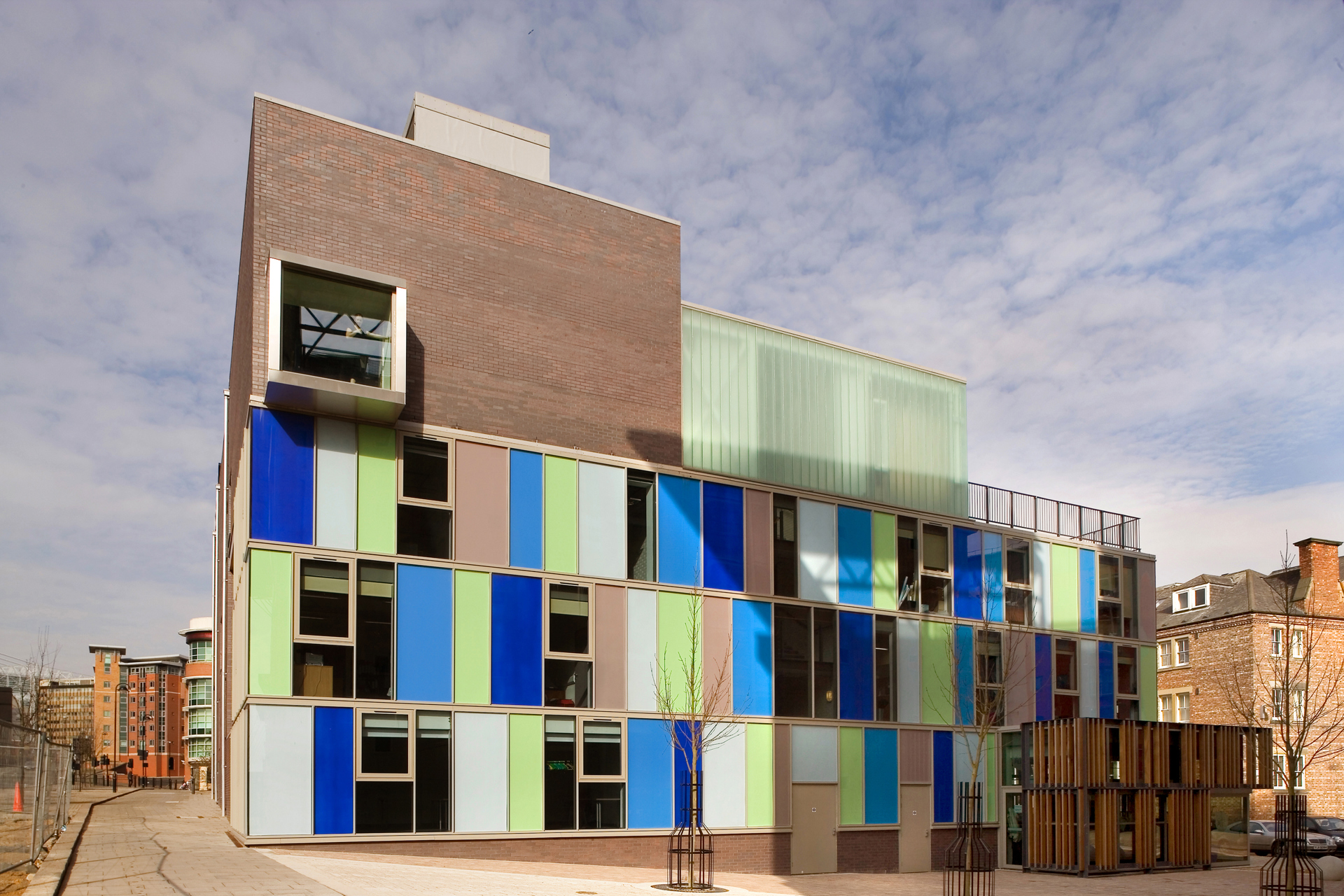 Image of Dance City building. Large colourful building with blue and green coloured blocks on it