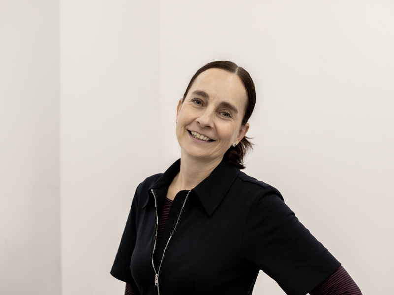 Image of Sam Lane, a woman with brown hair smiling at the camera Image of Sam Lane, a woman with brown hair smiling at the camera